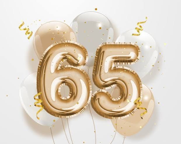 Gold number 65 surrounded by celebratory balloons